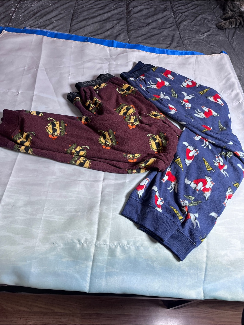 Old Navy Burgundy Novelty Pajama Pants with Yellow Character Print Two.